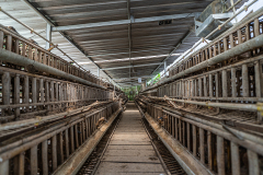 Rows of battery cages at a duck egg farm in Indonesia house hundreds of ducks. Indonesia, 2021. Haig / Act for Farmed Animals / We Animals
