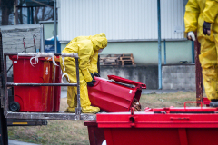 Dead hens are dumped on the ground from a garbage container outside the barns at an egg farm near Prague in Czechia. Workers wearing protective suits are killing and removing the hens from this farm due to an outbreak of the H5N1 bird flu virus there. Czechia, 2021. Lukas Vincour / Zvířata Nejíme / We Animals